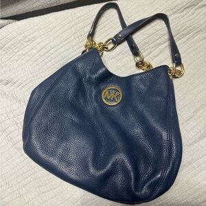 Authentic Michael Kors blue purse with gold accents